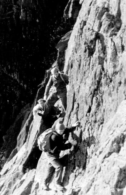 Cpl. Bill Barnes, No.4 Commando, and others, free climbing in Scotland