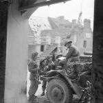 Captain J F Burgess, Royal Artillery, briefing a party of FOBs