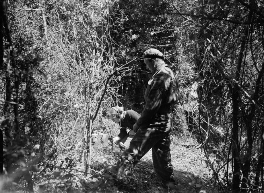 Naval telegraphist W J Crooks operating from a forward observation post in the Sword area.