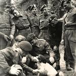 Fred Gamester No.3 Cdo. 2 troop (Heavy Weapons) and others with the troop mascot Spotty