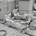 No.4 Cdos.,LBdr. Spencer plays chess with Pte. Gulvin. LCpl Preece reads book. June 1944