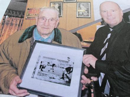 Jock Letham (46RM) being presented with a framed photo