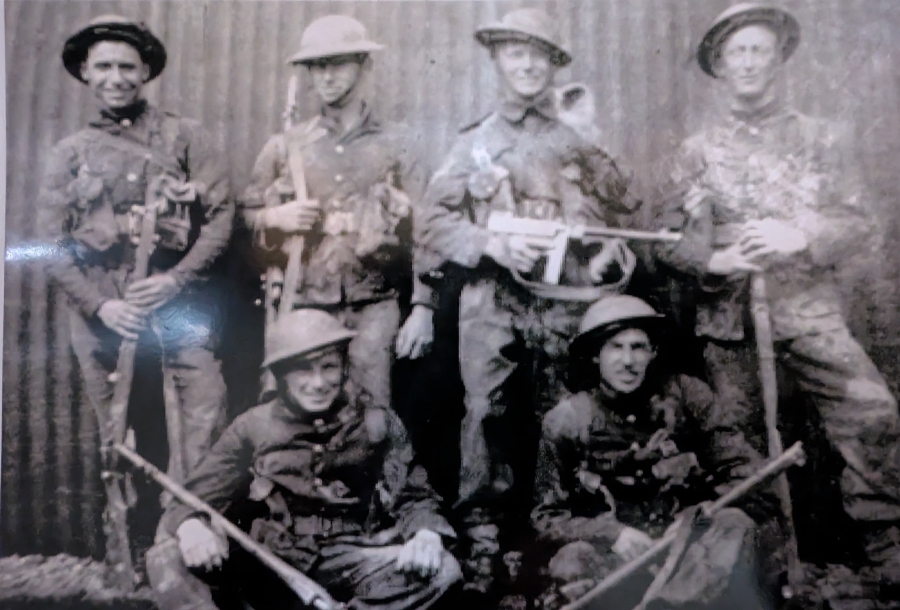 Mne. J.T. Oliver 5th RM Bn., (standing far right) and others