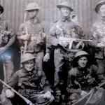 Mne. J.T. Oliver 5th RM Bn., (standing far right) and others