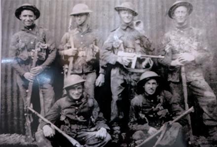 Mne. J.T. Oliver 5th RM Bn., (standing far right) and others