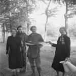 Two Dutch commandos being welcomed by Dutch women.