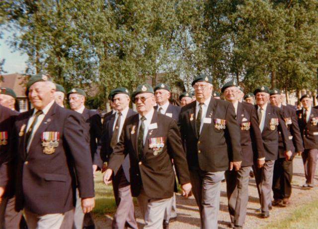 Veterans marching to the 45RM Cdo memorial cross in Le Plein 6th June 1997