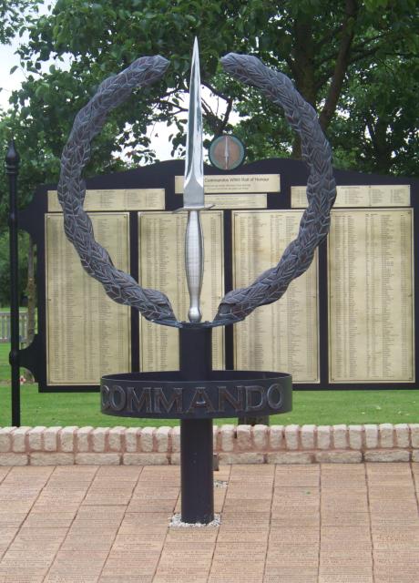 The CVA Memorial with the central stand of the Army Commando Memorial Wall behind.