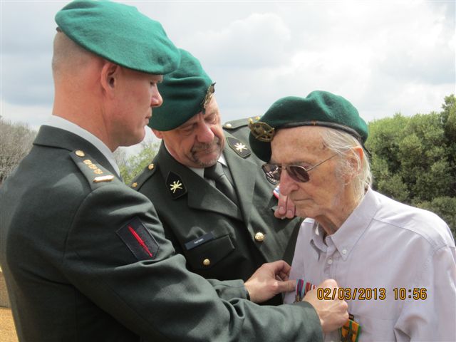 Herman Gobetz being presented with his medals
