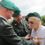 Herman Gobetz being presented with his medals