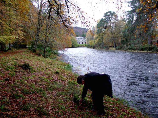 Bill Harvey lays the cross in memory of Bob