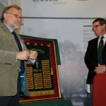 Ron Lane presenting his framed Commando Honours Battle Flag to the West Highland Museum