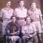 Sgt Harry 'Les' Hill (seated right) and others