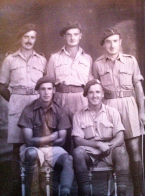 Sgt Harry 'Les' Hill (seated right) and others