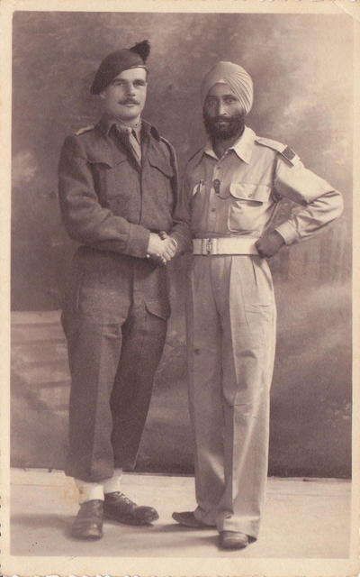 Lt Angus Ferguson No.9 Cdo., with a Liaison officer from the 7th Indian Infantry Bde.