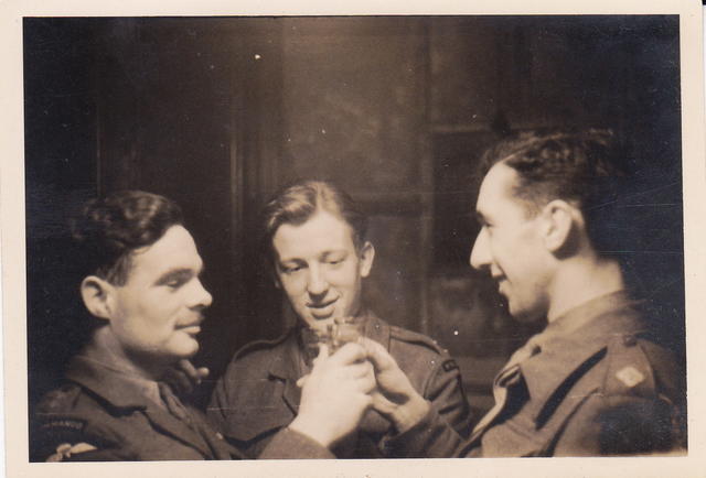 Lt Angus Ferguson No.9 Cdo. (left) and 2 unknown officers