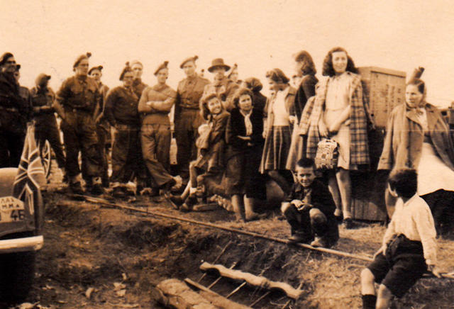 Group from 1 Troop, No 9 Cdo with local people at Strymon Bridge, Greece, November 1944