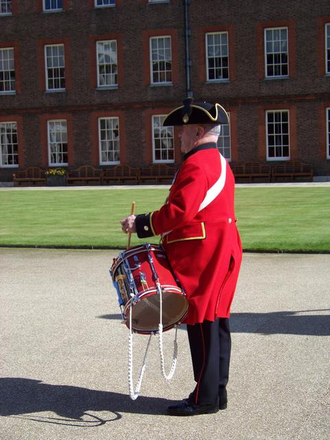 A drummer beats the Call to Parade...