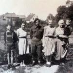 Roy Suzuki No 6 Cdo with a German family after liberating the village