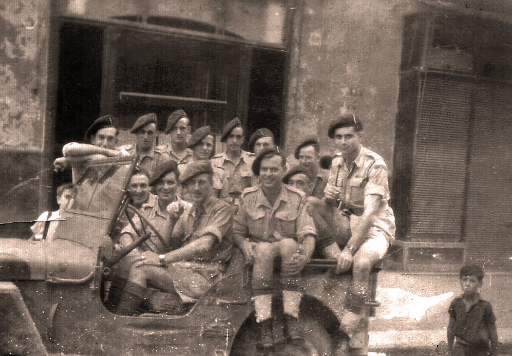 Fred Hausman, No.2 Commando, and others in jeep