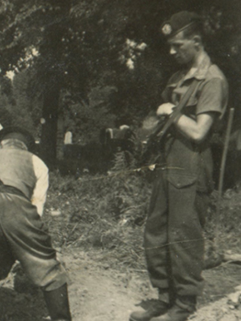 Piper Bill Millin, No  4 Cdo,, burial detail for German dead at Belsen May 1945.