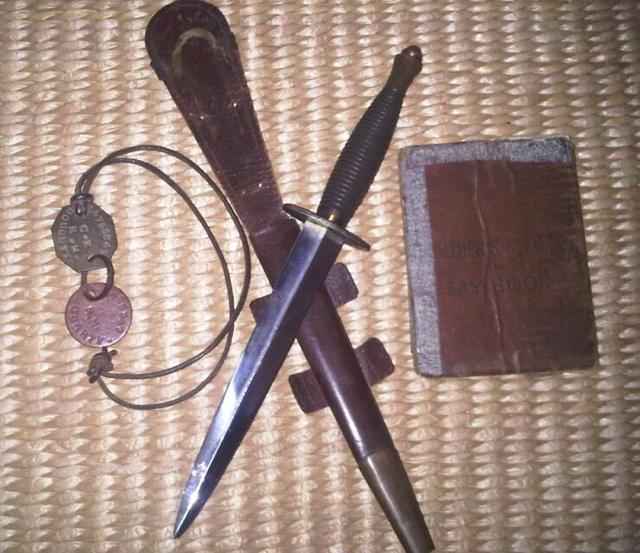 Ronald Doughty's pay book, dog tags and Fighting Knife.
