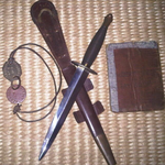 Ronald Doughty's pay book, dog tags and Fighting Knife.