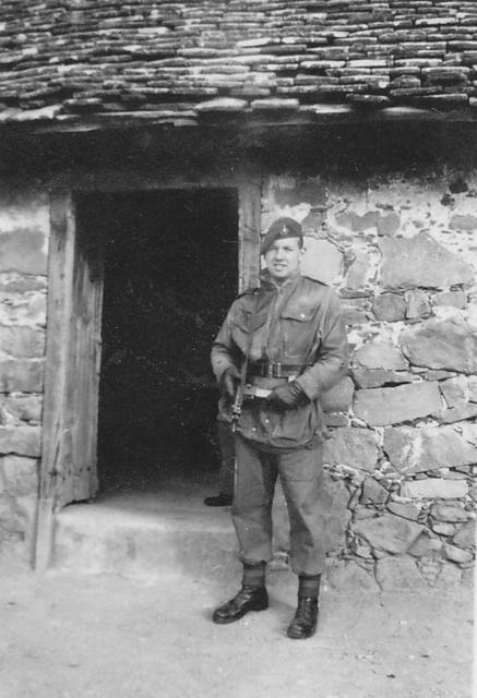 Mne. J.Sutherland, 45 Commando RM, at a church door in Cyprus c.1956