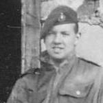 Mne. J.Sutherland, 45 Commando RM, at a church door in Cyprus c.1956
