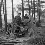 C/Sgt Gray, Sgt Harrison, and Mne Hedges, 45RM Cdo., with captured gun