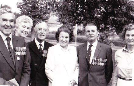 Maj. James Dunning, Capt. Donald Gilchrist, and Capt. Eric Cross MBE with their wives
