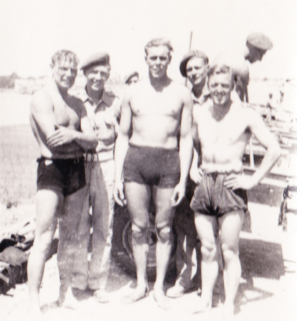 Bdr. John William ‘Jack’ White (left), Pete Smith (centre), and others from No.2 Commando