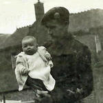 Patrick Wells holding his daughter Sheila