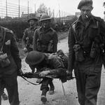 No 4 Commandos carrying a casualty Sword area, 6 June 1944