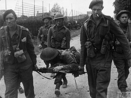 No 4 Commandos carrying a casualty Sword area, 6 June 1944