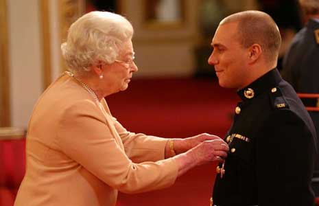 Her Majesty The Queen presents Matthew Croucher with his George Cross