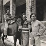 Titch Dyson on horseback, L/Cpl Pedder holding horse's nose, Fred Palmer hands on hips - No 5 Commando