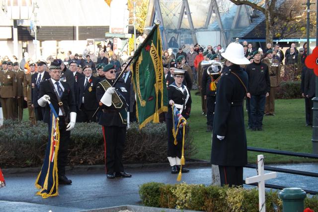 The Last Post. The Colour Party lowers The Standards.