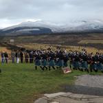 The Pipe Band leads the procession to The Monument.