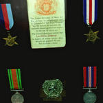 Medals and cap badge of LCpl. John Donaldson No 2 Commando
