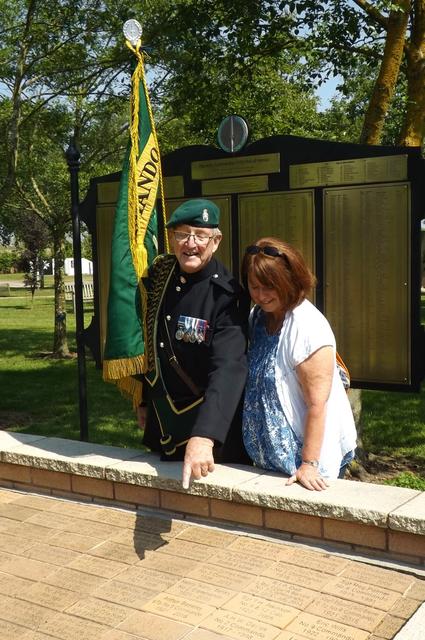 Fred Davies shows Anne George her father's paver