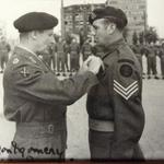Sgt. Cyril Dobb, No.6 Cdo., receiving his MM from Montgomery