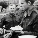 A decorated Polish Major greets a comrade.