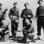 Commandos displaying captured German weapons, Italy April 1945
