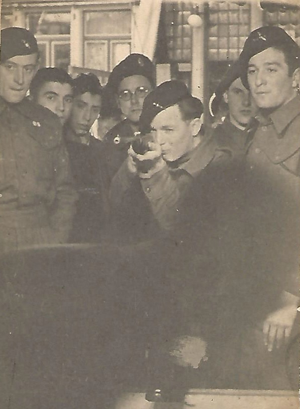Pte. Derrick Dryden (holding rifle) and others, Brugge 4 May 1945
