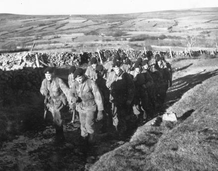 781 Squad RM yomping up onto Dartmoor for field firing.