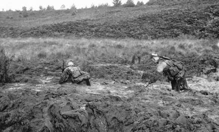 Recruits in swamp on Endurance Course well bogged down.