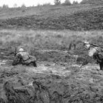 Recruits in swamp on Endurance Course well bogged down.