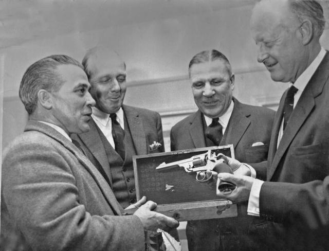 Adrian Stevens being presented with Colt revolver at Bisley